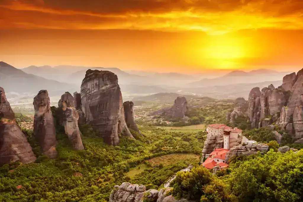 Meteora monasteries at sunset, a day trip from Panorama Suites & Spa