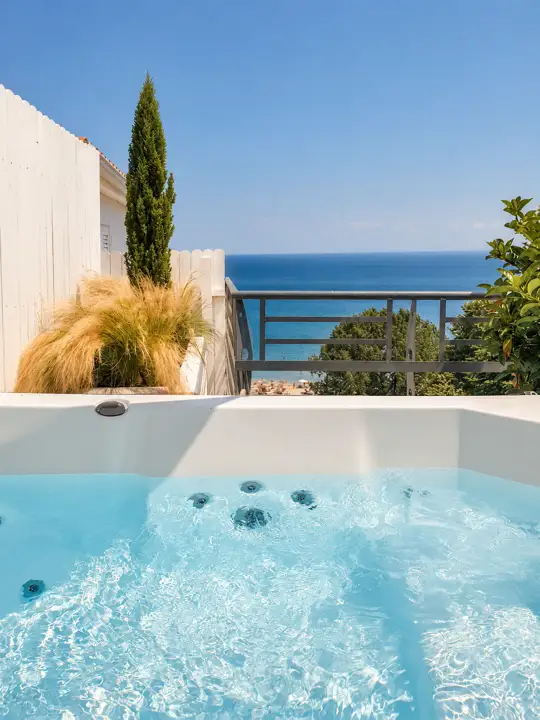 Aegean Spa Suite with indoor jacuzzi, sauna and rooftop jacuzzi, sea view – outdoor heated jacuzzi overlooking the beach and the Aegean · Panorama Suites & Spa, Stomio