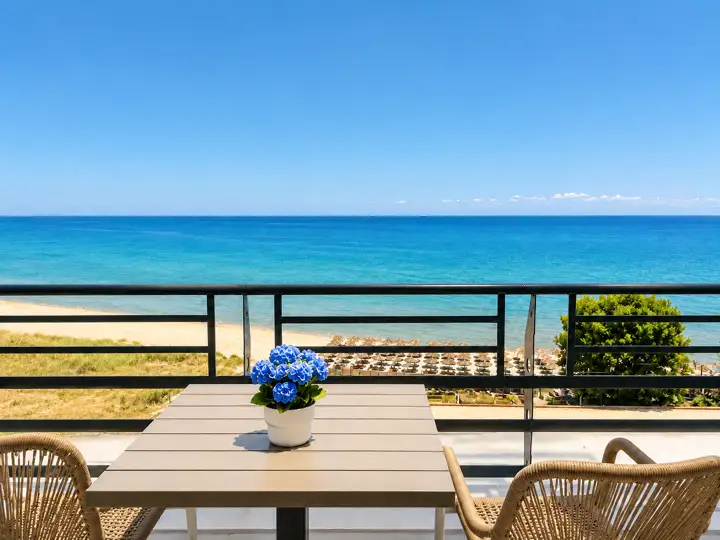 Blue Sky Suite with rooftop heated jacuzzi and sea-view hot tub – balcony table with direct view of the beach and the Aegean · Panorama Suites & Spa, Stomio