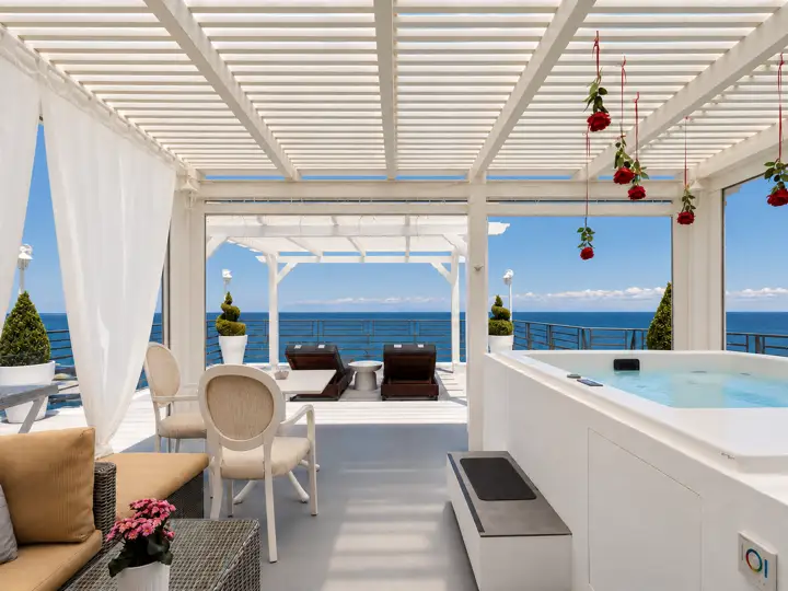 Master Sky Suite with heated jacuzzi, sauna and rooftop terrace, sea view – covered pavilion with heated jacuzzi, lounge and open sea view · Panorama Suites & Spa, Stomio